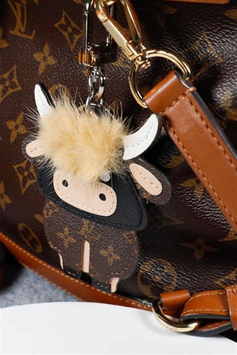 louis vuitton highland cow keychain|Louis Vuitton luggage charms.